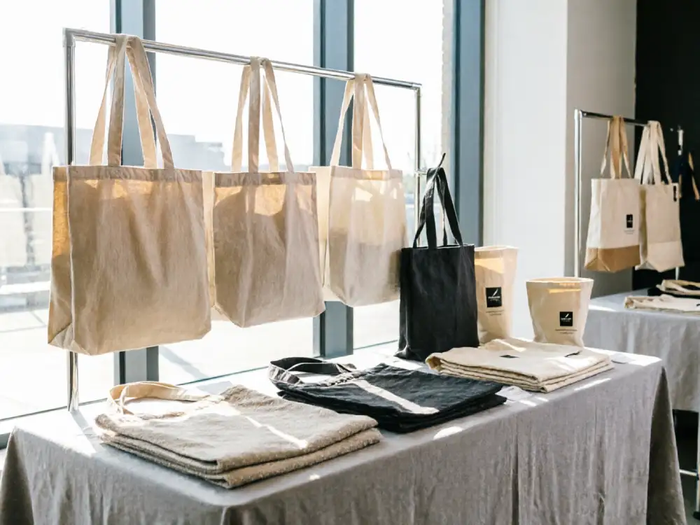 Promotional tote bags displayed for trade show and retail marketing campaign use